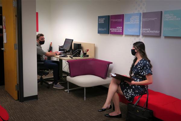 A student waits for her interview in the On-Campus Interview Suite